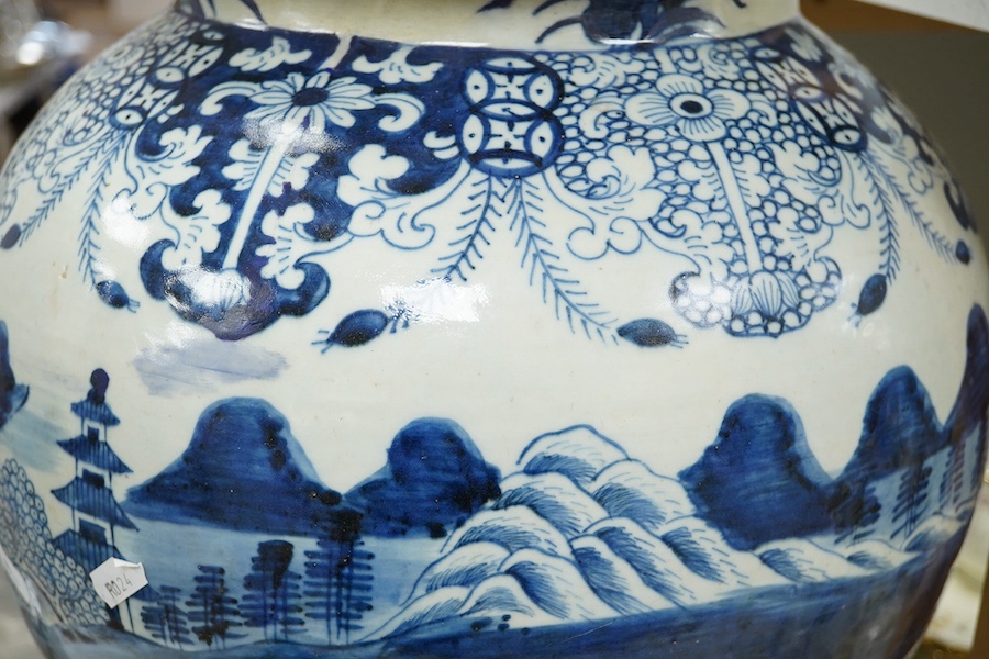 A large 19th century Chinese blue and white vase with cover, 63cm high. Condition - restored